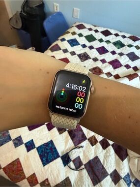 Apple Watch SE with band and charger
